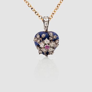 A Victorian ruby, diamond and enamelled pendant with chain.