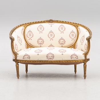 A Gustavian style sofa with two armchairs and two chairs, 20th century.