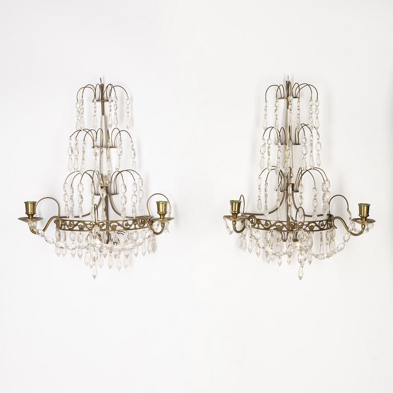 A pair of Gustavian style two-branch wall lights, 20th century.