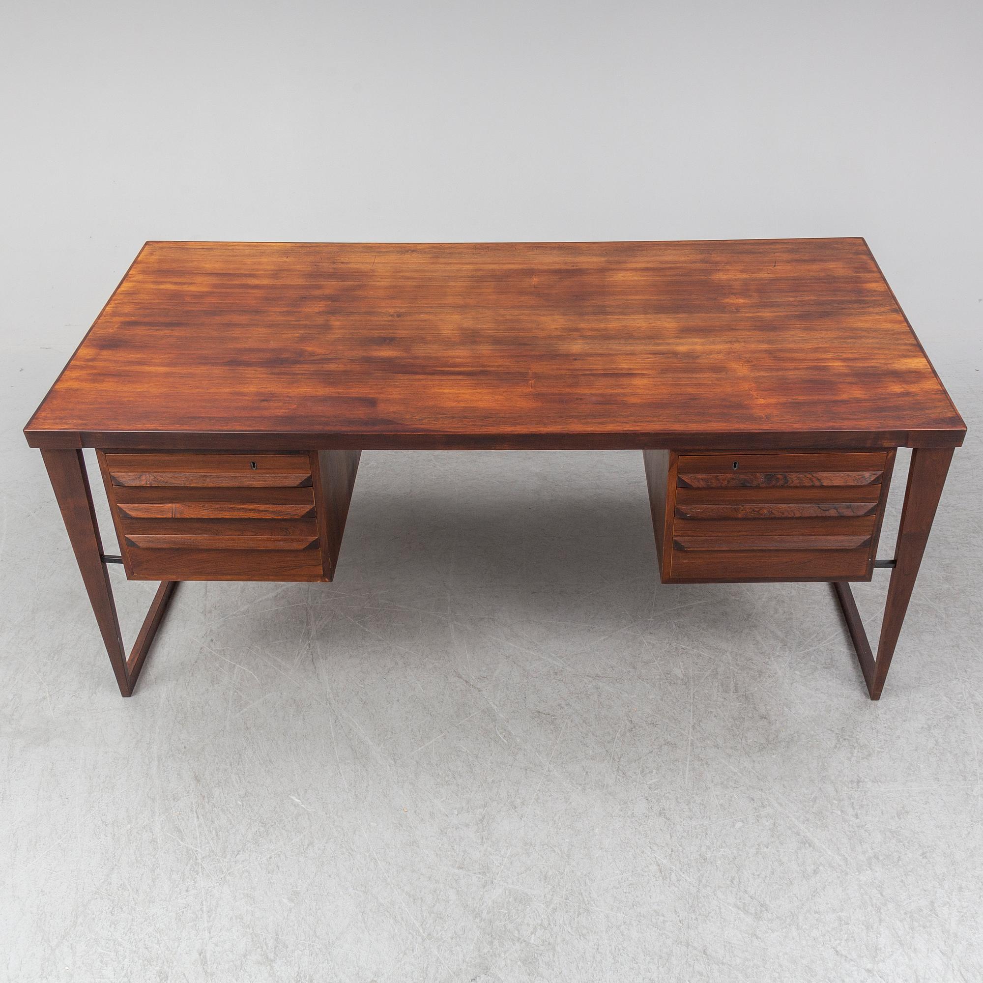 A 1960's rosewood desk by Kai Kristiansen, Feldballes Møbelfabrik, Denmark.