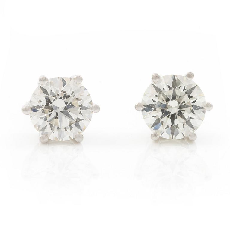Earrings, single-stone earrings in 18K white gold with brilliant-cut diamonds.