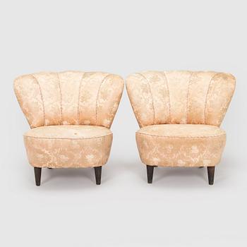 A pair of mid-20th century armchairs.