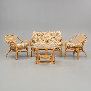 A set of sofa, easy chairs and table in four parts, late 20th century.