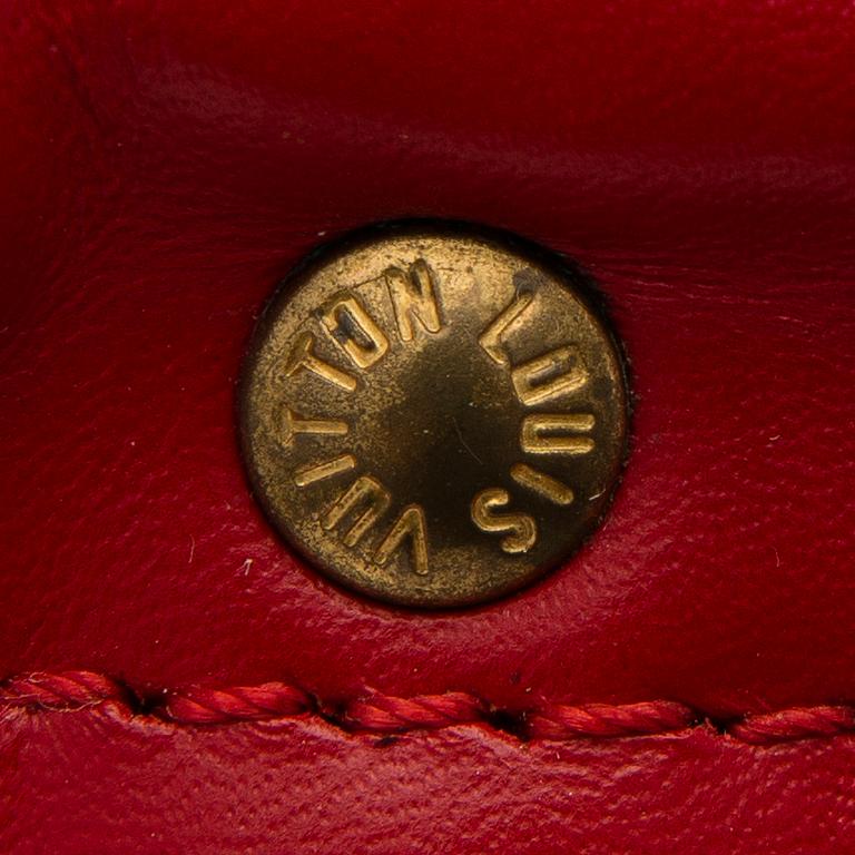 A RED EPI LEATHER KEEPALL 50 TRAVEL BAG.