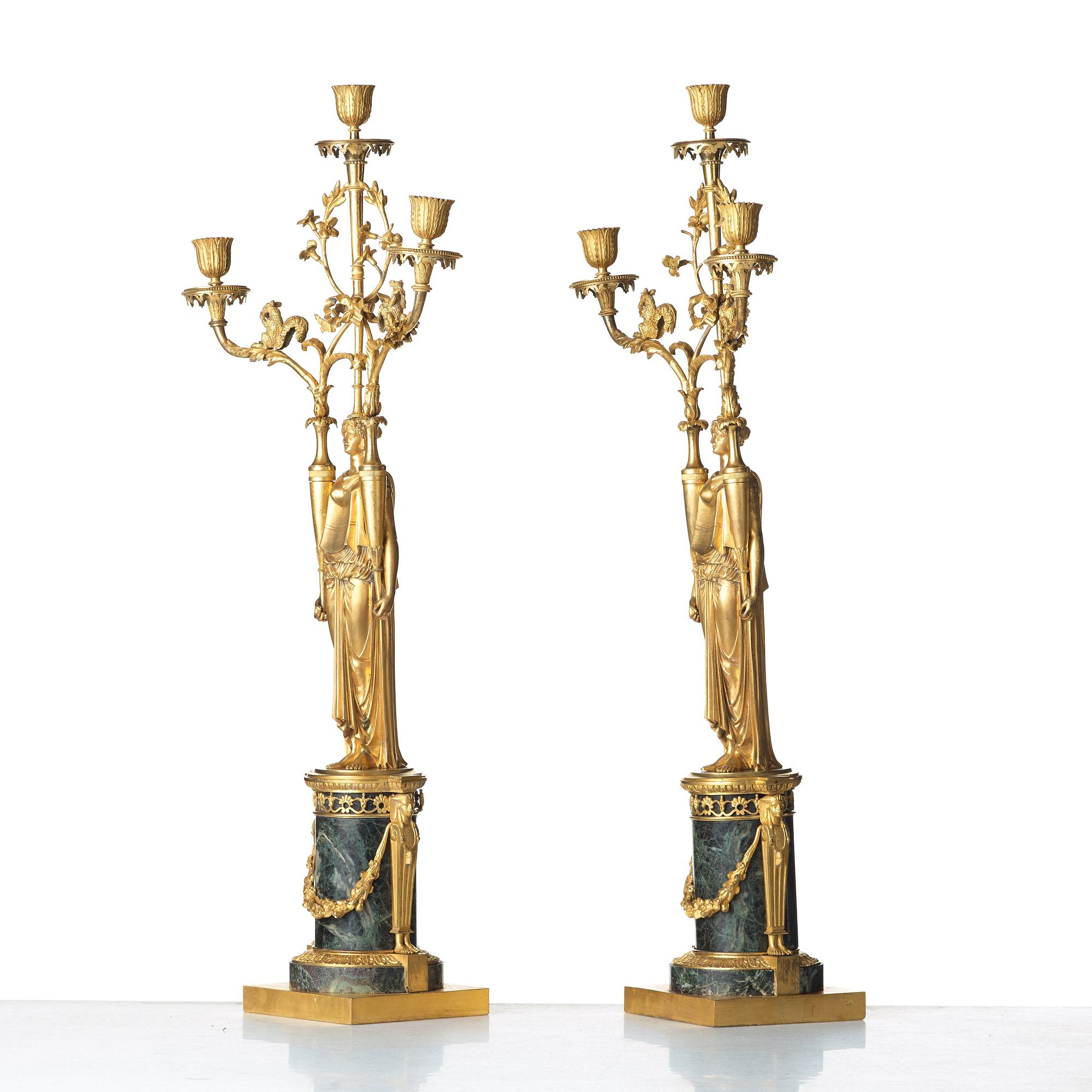 A pair of French Directoire three-light candelabra, circa 1800.