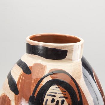 A glazed ceramic vase signed.