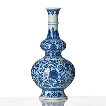 A blue and white gourd shaped lotus vase, presumably Chinese Republic with Qianlong mark.