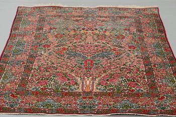 A RUG, a semi-antique Kerman "mille-fleur", ca 198,5 x 136,5 cm.