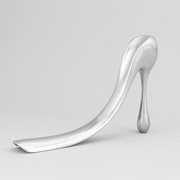 Manolo Blahnik, a metal shoe horn, 21st century.