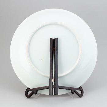 A large Chinese dish with a fierce five clawed dragon, modern.