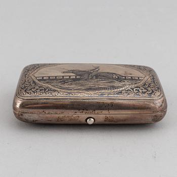 A Russian parcel-gilt silver and niello cigarette case, unidentified makers mark, Moscow 1891.