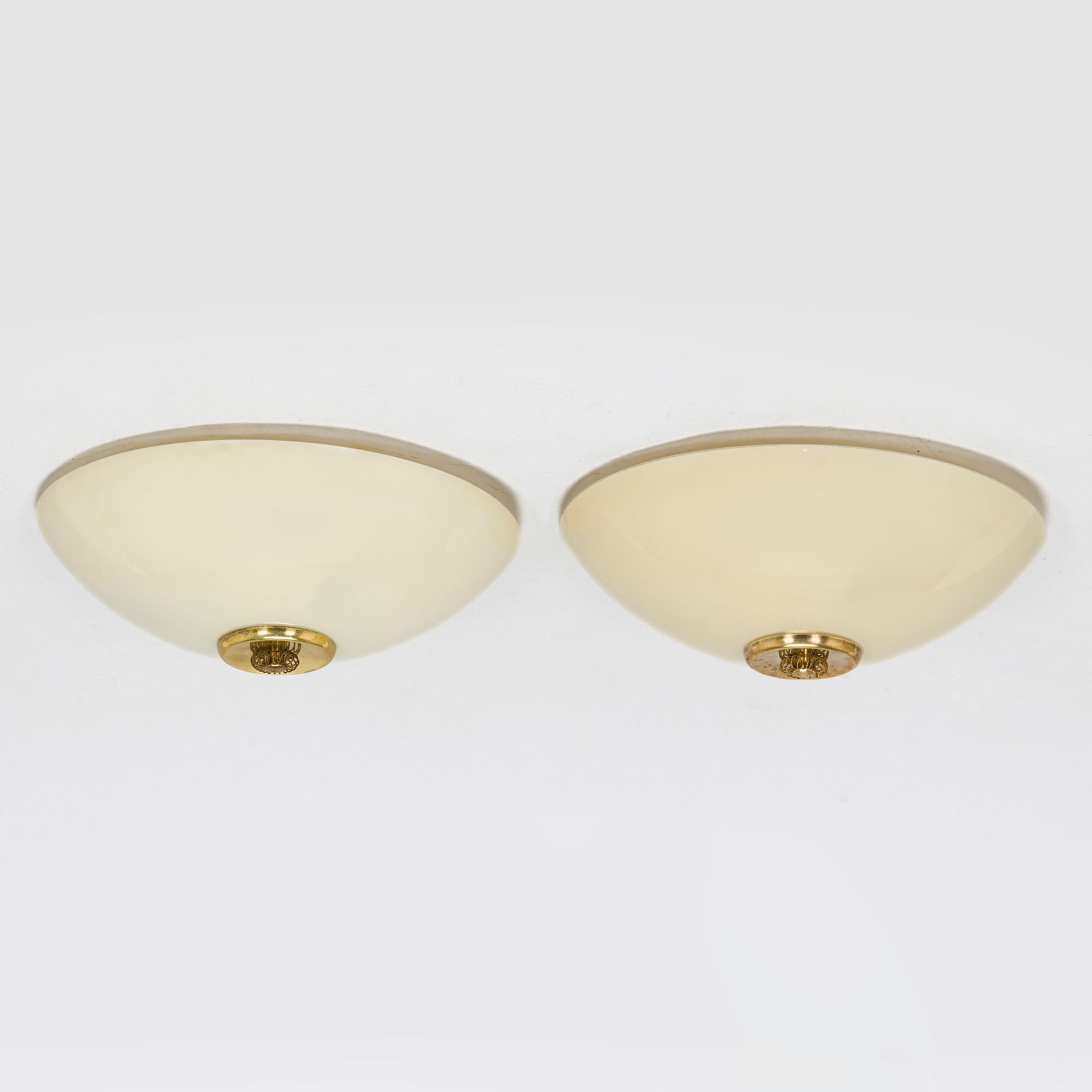 A pair of mid-20th century 'EA 72 ceiling lights for Itsu.