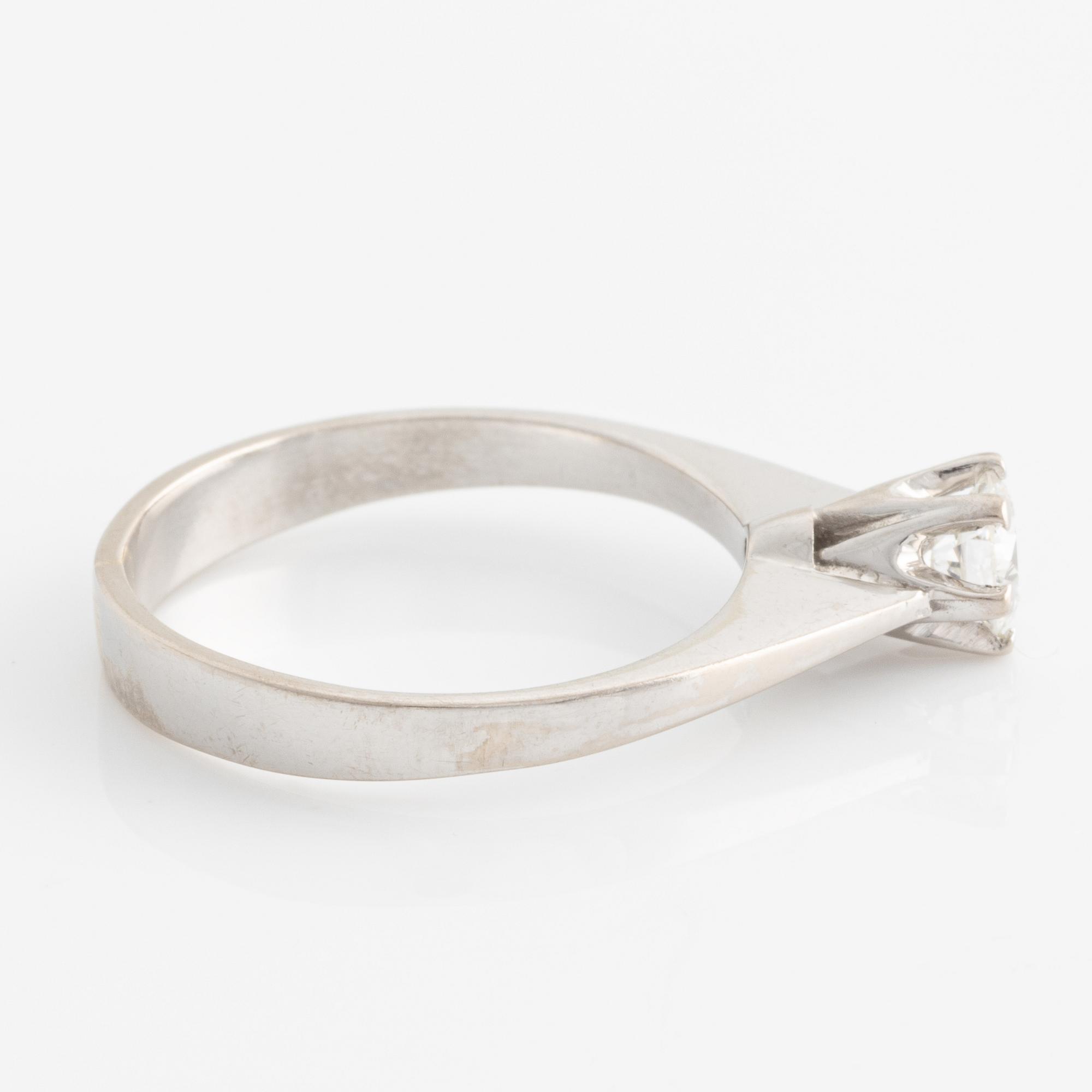 Ring solitaire with brilliant-cut diamond.