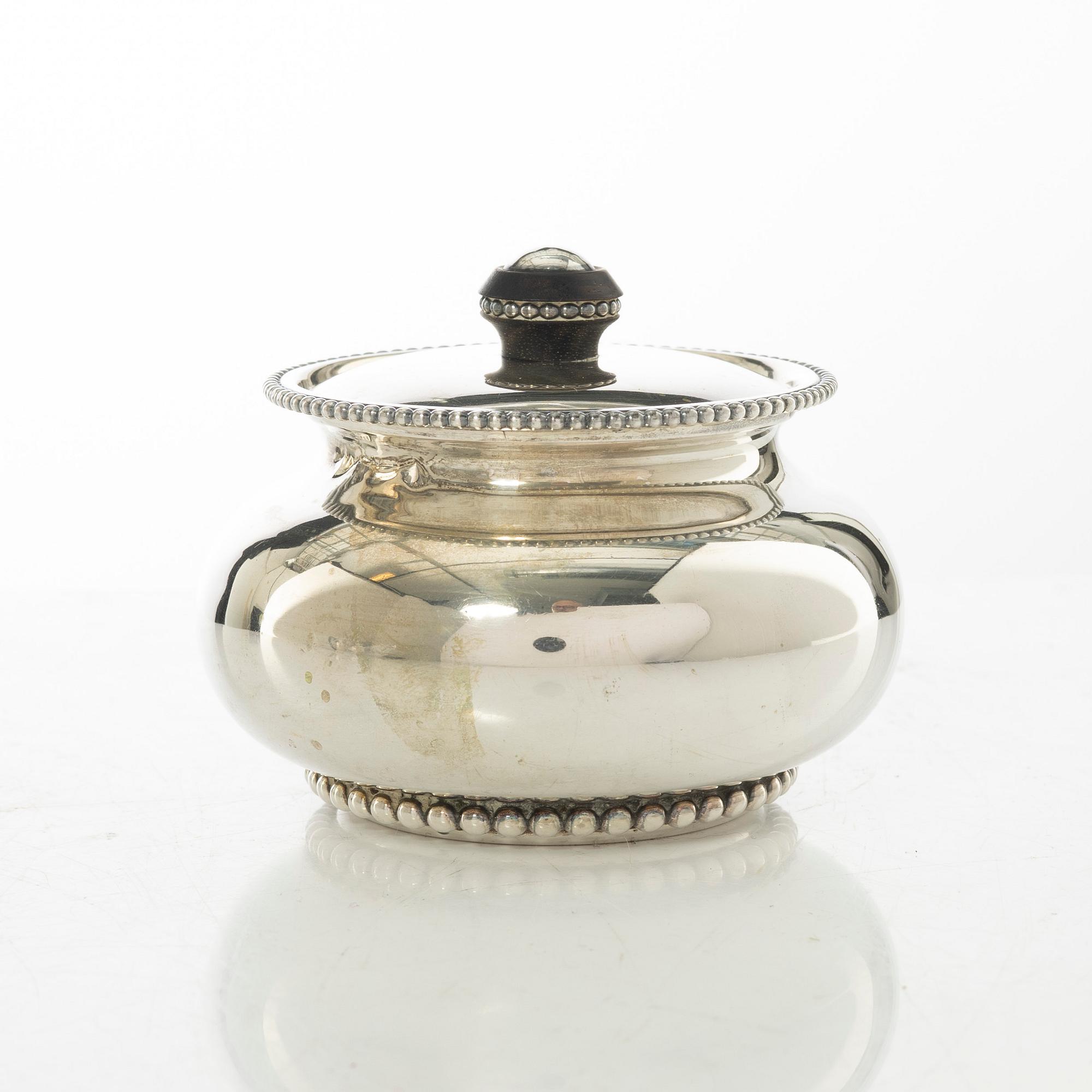 An Italian silver teapot, cream jug and sugar bowl, 20th century.