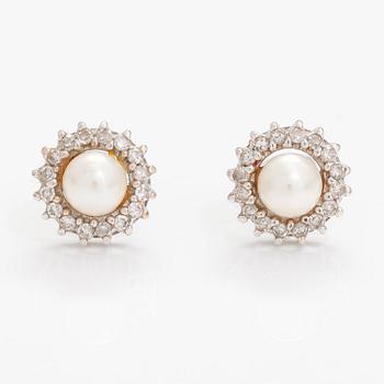 A pair of 14K white gold earrings with diamonds ca. 0.32 ct in total and culturd pearls. Bucherer.