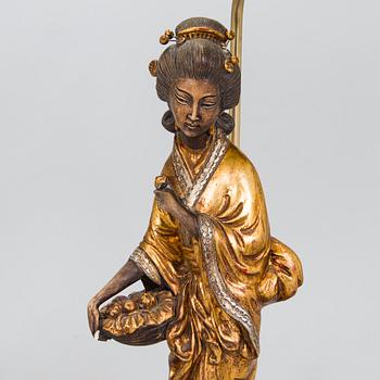 A pair of table lamps with Asian figures, later half of 20th century.