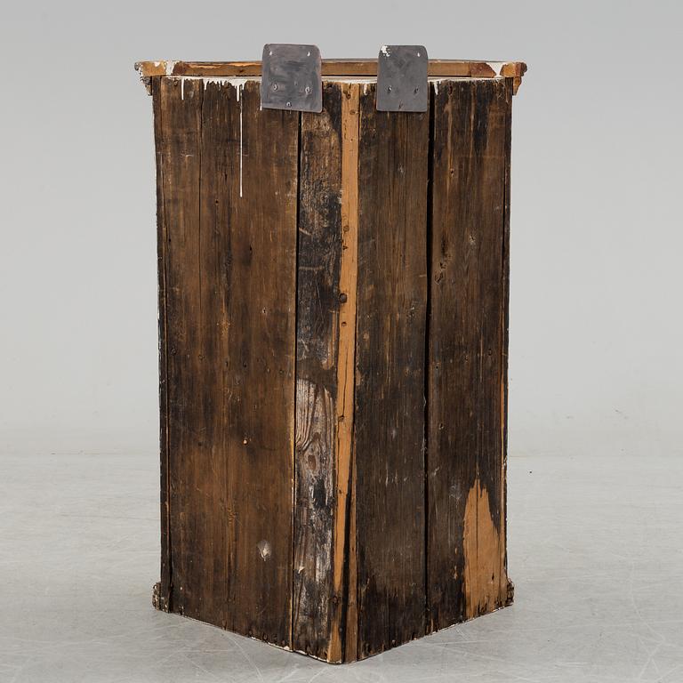 A painted folk art corner hanging cabinet, ca 1800.