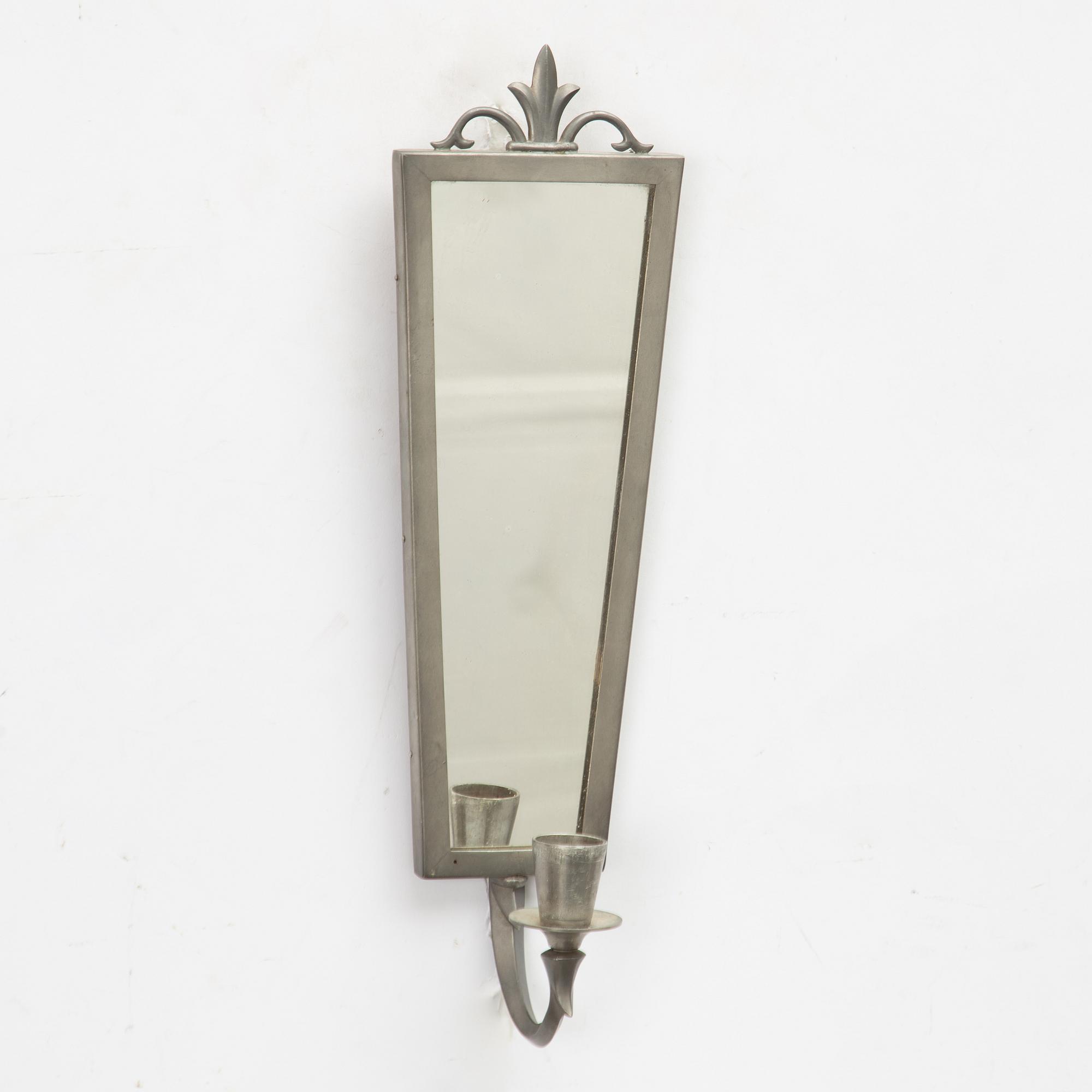 A mirror and pair of wall sconces, Sweden, 1932.