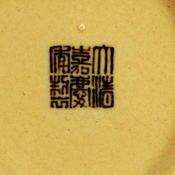 Two yellow ground dishes, Qing dynasty with Jiaqing sealmark (1796-1820) and Daoguangs sealmark and period (1821-1850).