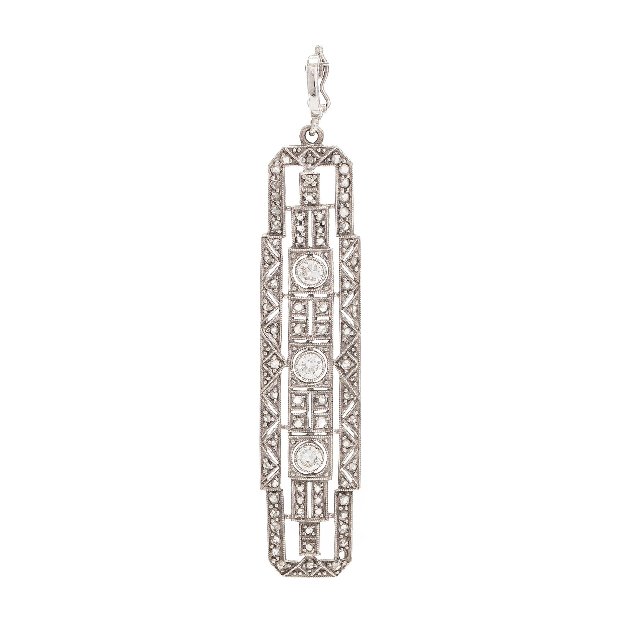 An 18K white gold pendant set with brilliant-cut and rose-cut diamonds.