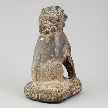 A stone sculpture of a mythical beast, China, 20th Century.