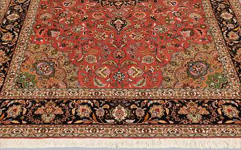 A part silk Tabriz carpet, approx. 50 Raj, 292 x 202 cm.