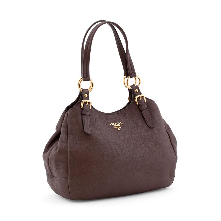 PRADA, a brown leather shoulder bag.
