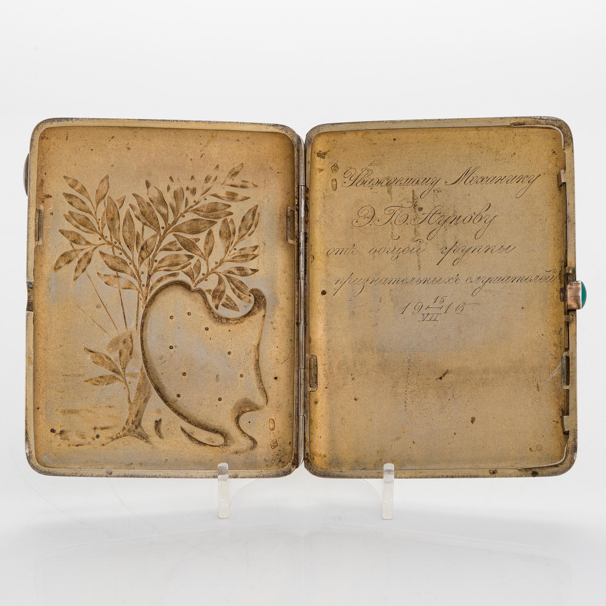 A silver cigarette case, Moscow, dated 1916.