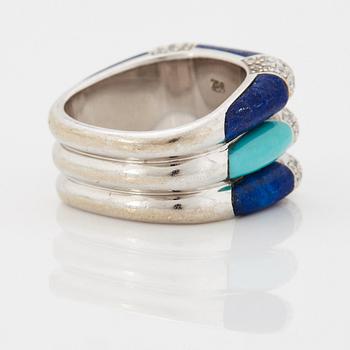 A Paul Binder ring in 18K white gold set with lapis lazuli, turquoise and round brilliant-cut diamonds.