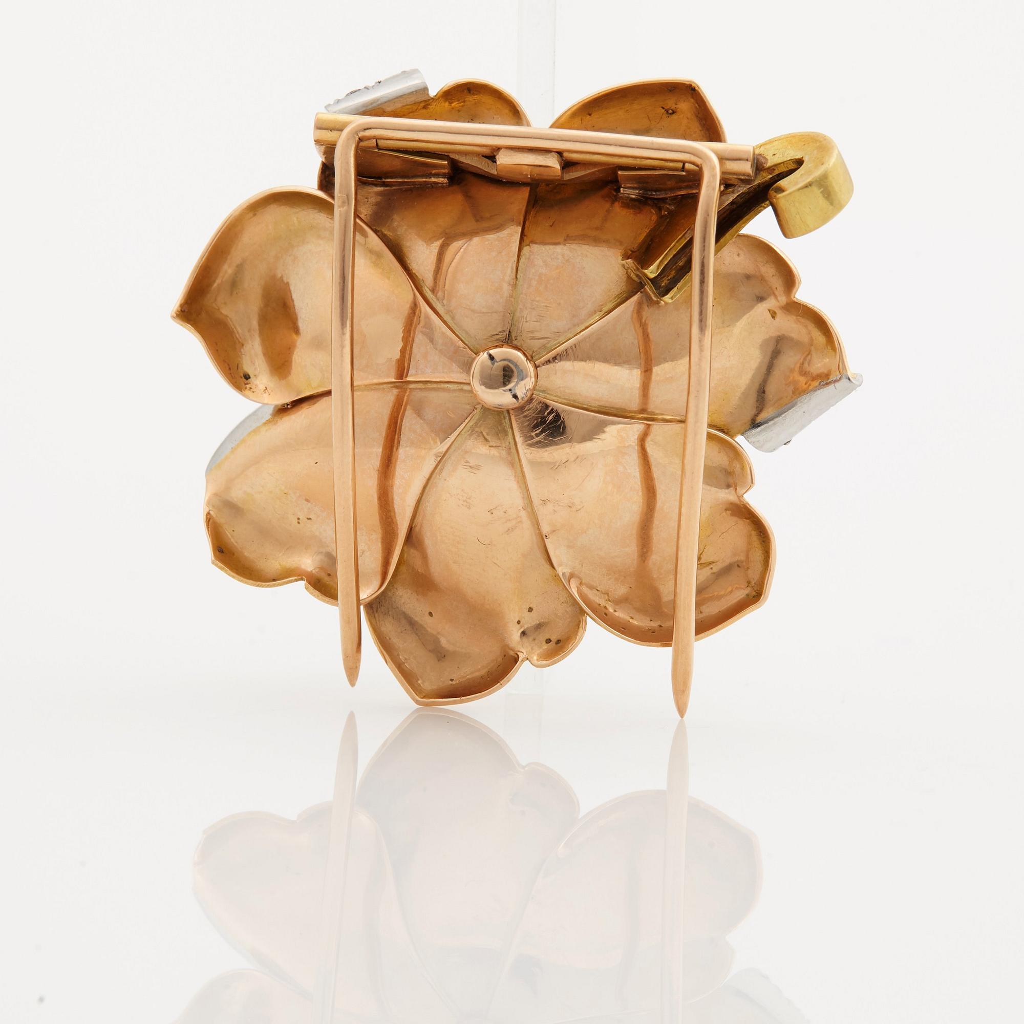 A 1940/50s brooch by Boucheron, in the shape of a flower, set with brilliant cut diamonds.