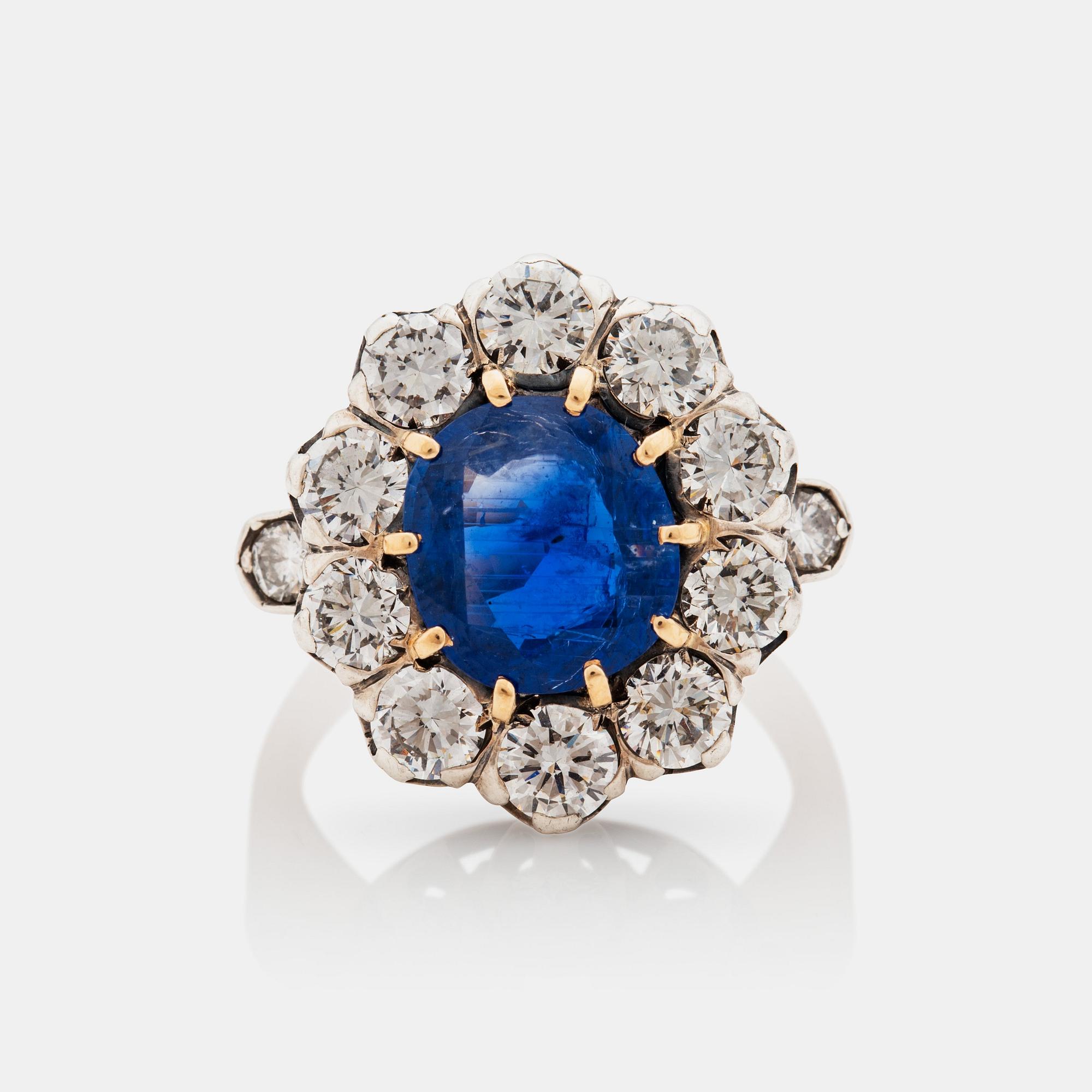 A 3.29 ct Burmese sapphire and brilliant cut diamond ring. Certificate from SSEF.