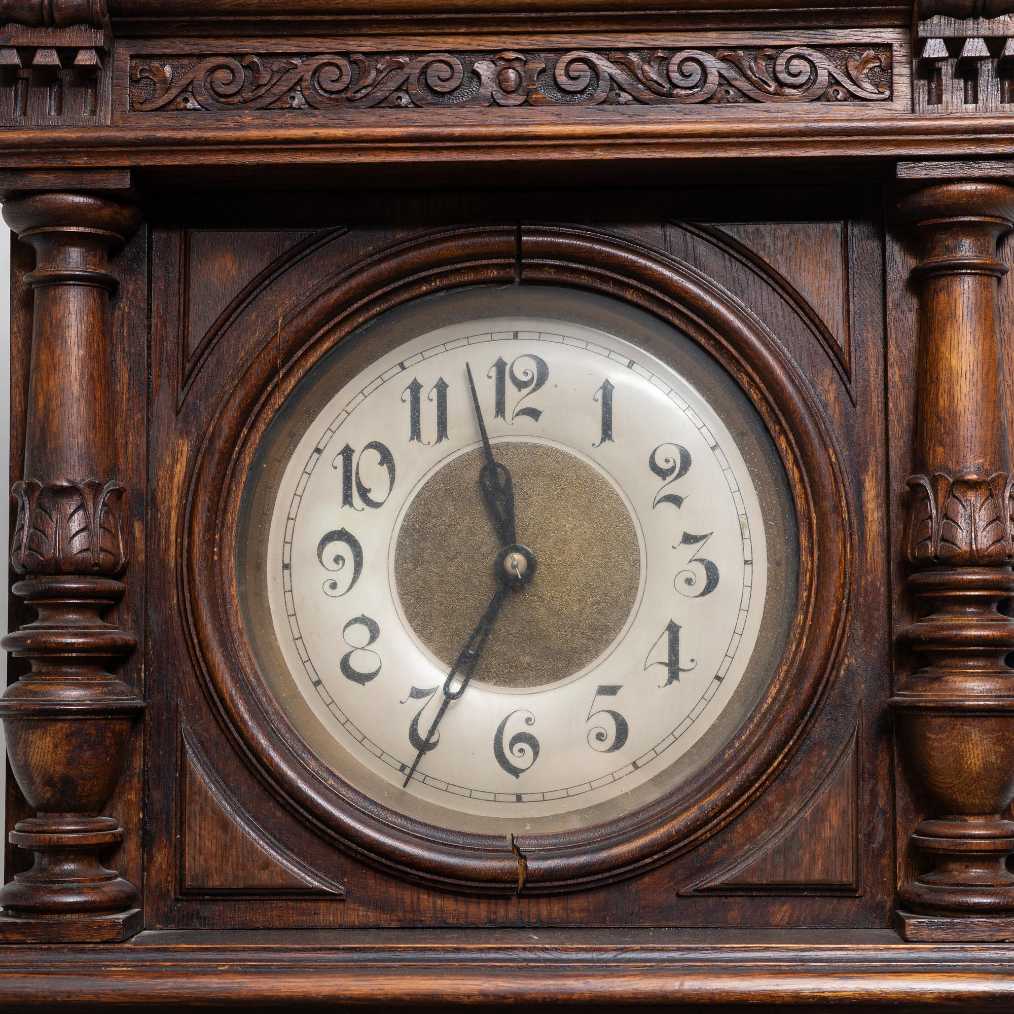 A long-case clock, late 19th century.