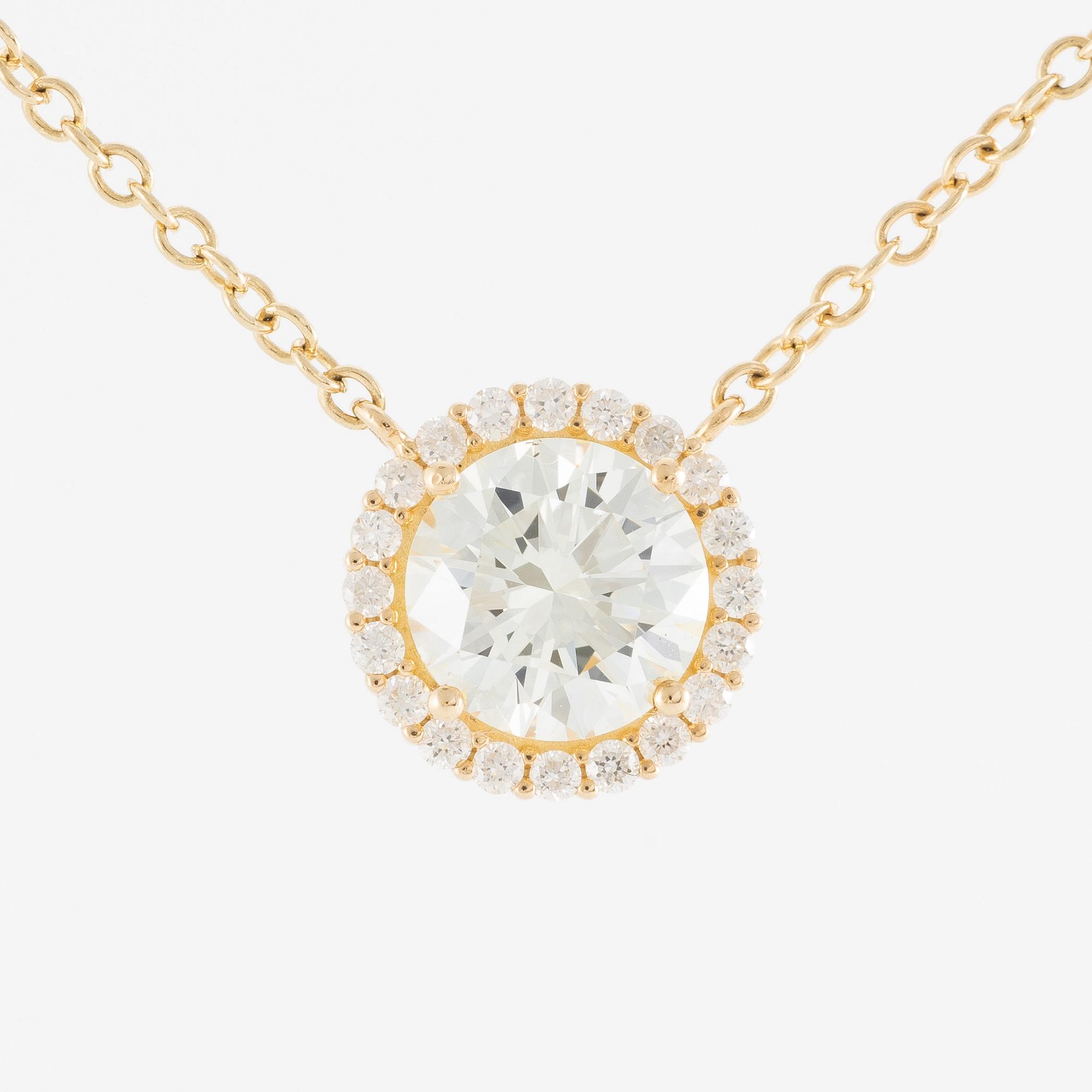 Collier 18K guld med briljantslipade diamanter.