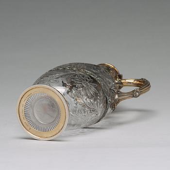 An English 19th century silver-gilt and glass wine-jug, marked Hunt & Roskell Late Storr & Mortimer, London 1895.