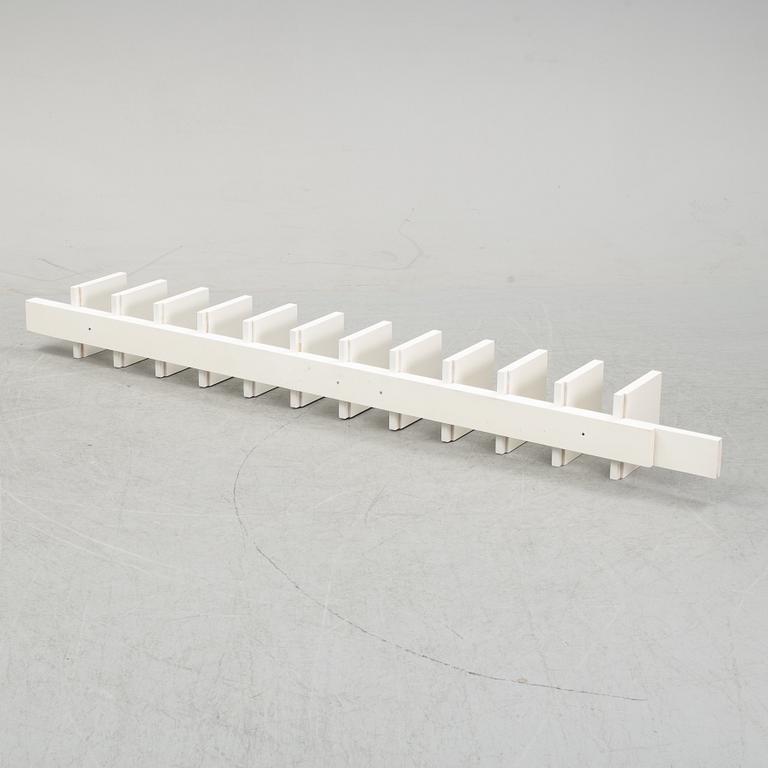 A 'Pilaster' shelf by John Kandell for Källemo, designed 1988.