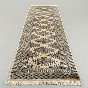 An old Pakistan carpet ca 283 x 81 cm.