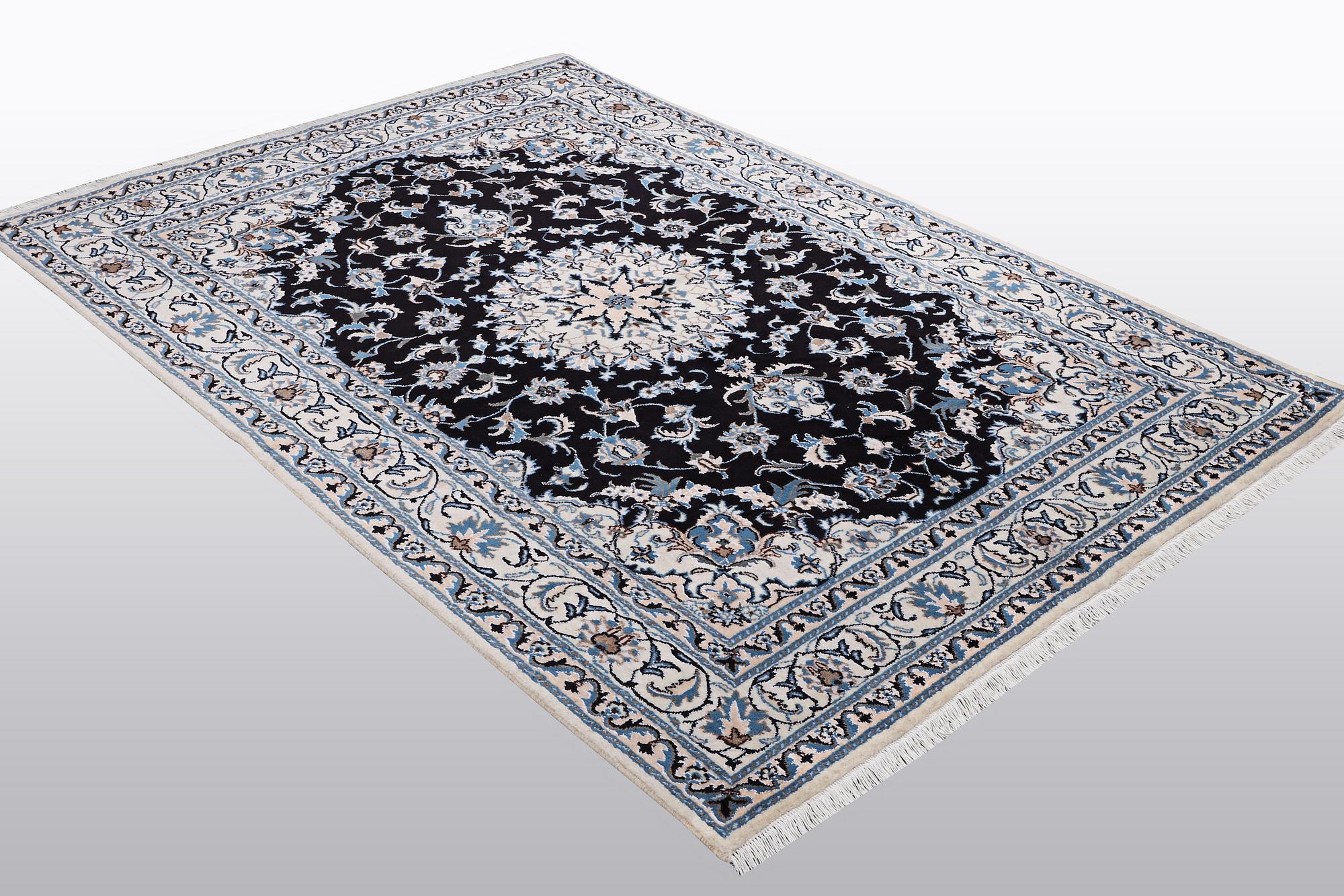 A rug, Nain, part silk, ca 242 x 167 cm.
