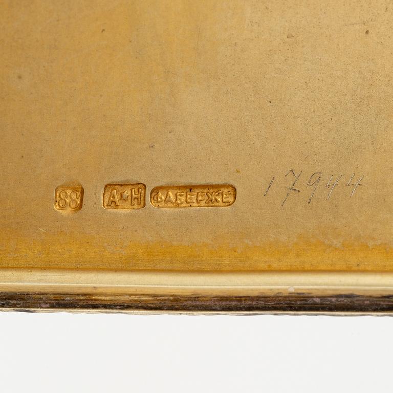 A Silver-gilt Fabergé Cigarette and Match Case, workmaster August Frederik Hollming, St. Petersburg 1908-1917.