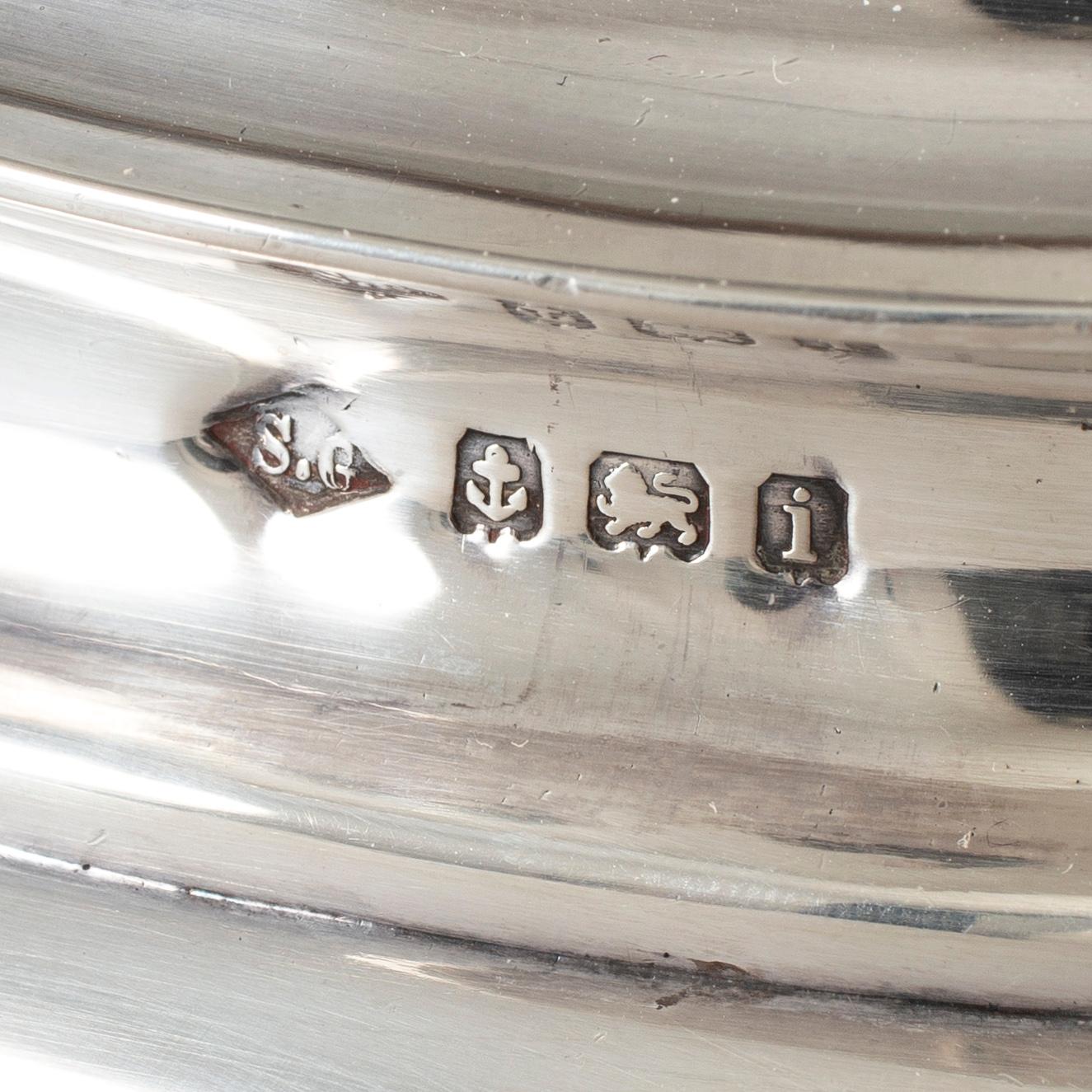 A silver teapot, creamer and sugar bowl, S Glass, Birmingham 1908.