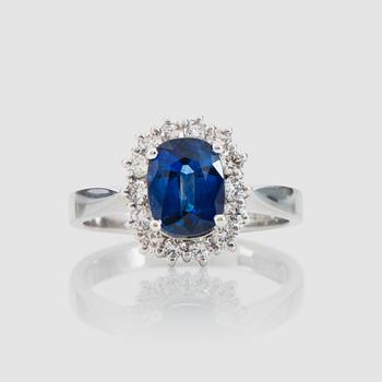 1382. A circa 1.72 st sapphire and brilliant-cut diamond ring. Total carat weight of diamonds circa 0.56 ct.