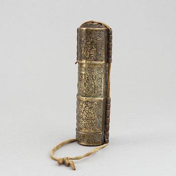 A Tibetan prayer roll and a metal roll with compartments with prayer rolls, 19th Century.