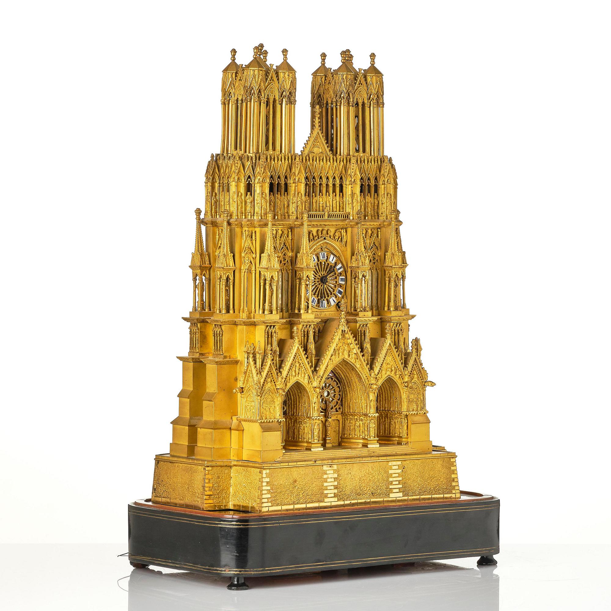 A Charles X ormolu mantel clock modelled as the Cathedral of Reims, Paris, 1820's.