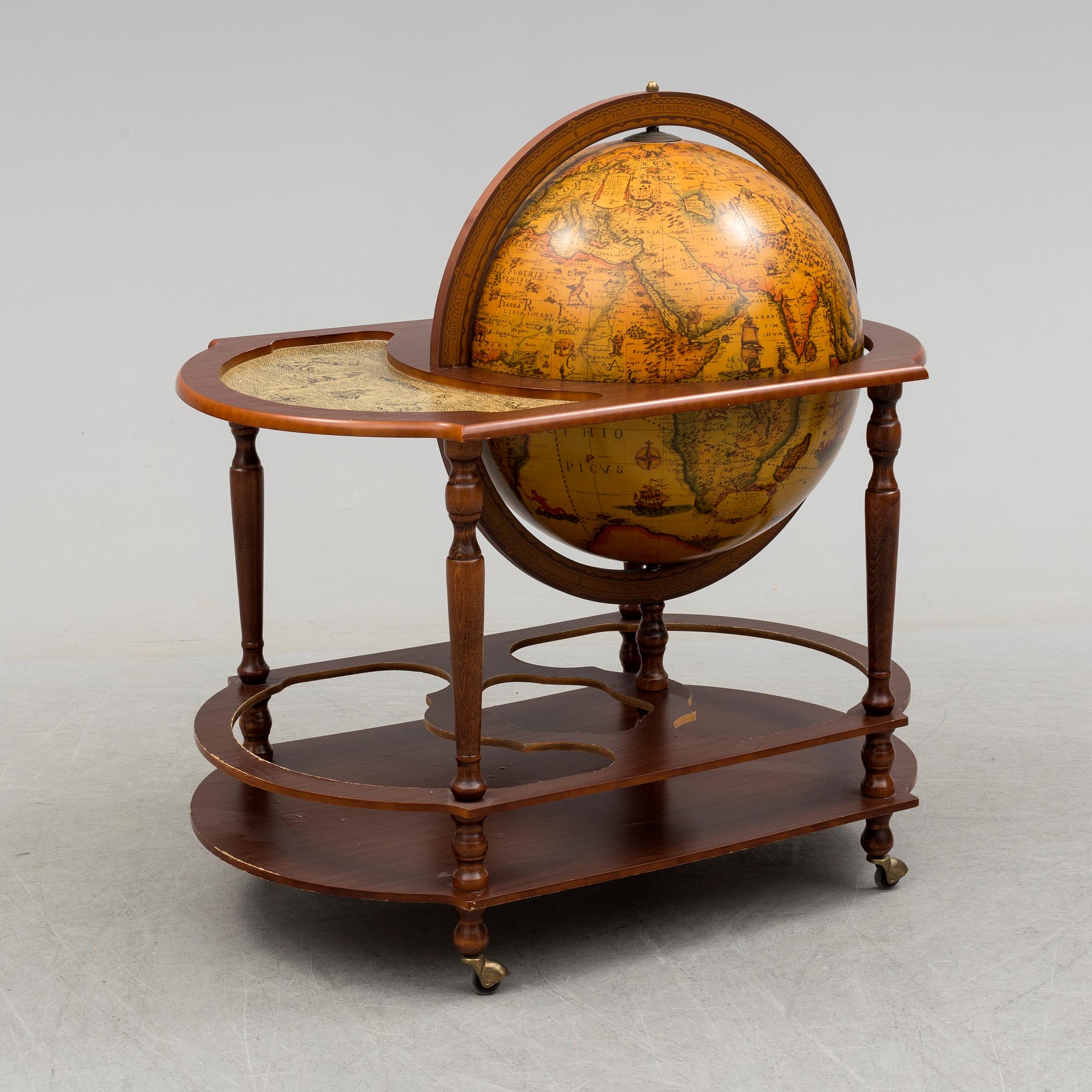A globe shaped drinks cabinet, circa 2000.
