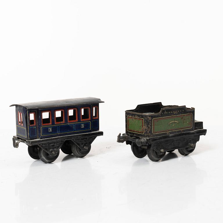 Model train with track and station building, 13 pieces, Germany, 1920s.