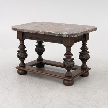 A 19th century Baroque style stone-top table.