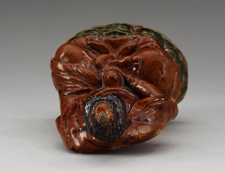 A ceramic figure of Buddha, Ming dynasty, 17th Century.