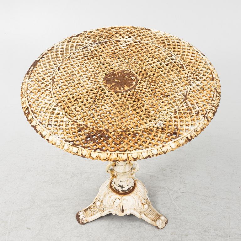 A cast iron garden table, first half of the 20th Century.