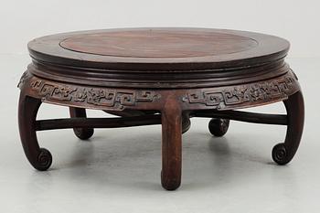 A round hardwood table, Qing dynasty.