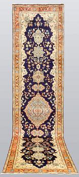 A Tabriz runner, so called Tabatabai, ca 402 x 97 cm.