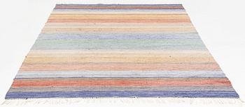 A rag rug, c. 300 x 195 cm.